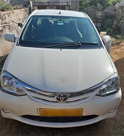 front outer part of Toyota Etios.You can used Toyota Etios under car rental service provided by Namaste Holiday. 