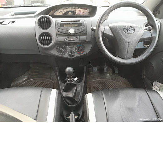 front interior part of Toyota Etios.You can use Toyota Etios under car rental service provided by Namaste Holiday.